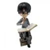 Figurine Harry Potter Sur Une Pile De Grimoires -Harry Potter Série Magasin figurine harry potter sur une pile de grimoires